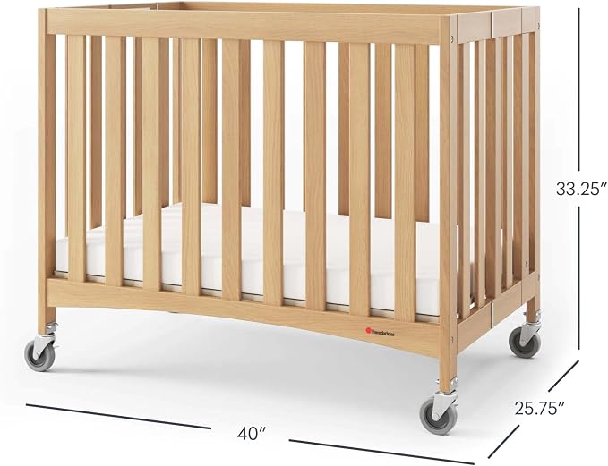 Foundations Travel Sleeper Wood Compact Folding Crib with 2” InfaPure Foam Crib Mattress and Commercial Grade Casters for Hotels, Natural