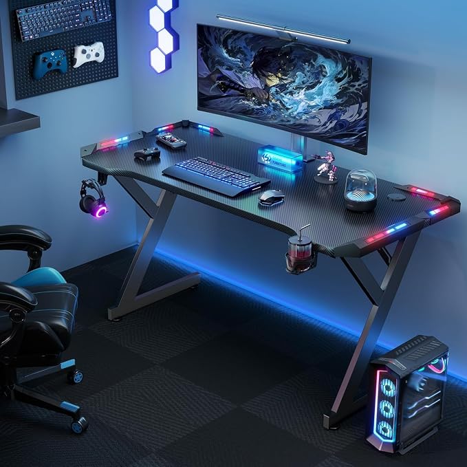 HLDIRECT 55 Inch Gaming Desk with LED Lights, Ergonomic Computer Gaming Table with Carbon Fibre Surface, Sturdy PC Workstation Desk for Home Office with Headphone Hook, Cup Holder, Black