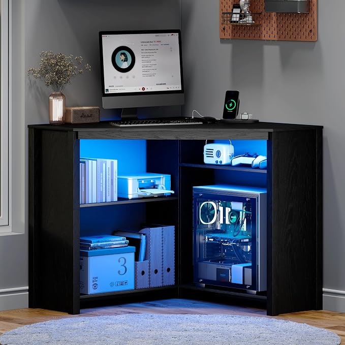 Corner Desk with Charging Station and LED Lights, Black | Triangle gaming computer desk for home office. Features space saving storage shelves, CPU stand, and smart LED light