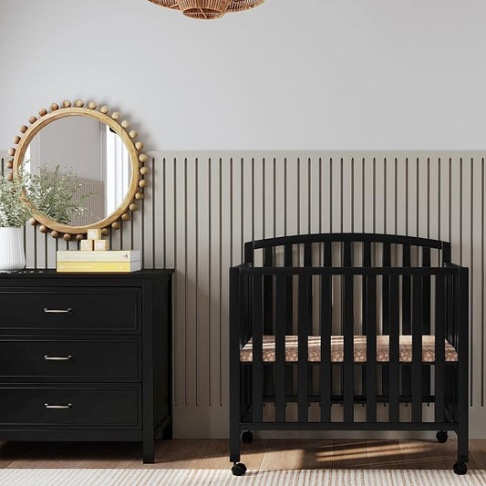Davinci Dylan 3-in-1 Convertible Portable Mini Crib, Ebony | GREENGUARD Gold Certified - Folding Baby Crib With Wheels, 4 Adjustable Mattress Heights, Conversion Kit Sold Separately