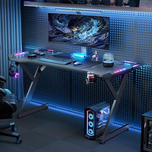 HLDIRECT 63 INCH Gaming Desk with LED Lights, Home Office Gamer Desk, Ergonomic Computer Table with Large Carbon Fiber Desktop, Office Workstation with Mouse Pad, Cup Holder & Headphone Hook, Black