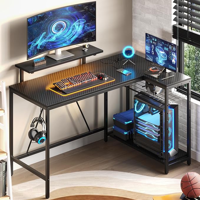 Bestier 52" Gaming Desk with Integrated Power Outlet & USB Ports, L-Shaped Computer Desk with LED Strip & Headphone Hooks, Perfect for Home Office Pink,Carbon Fiber Black