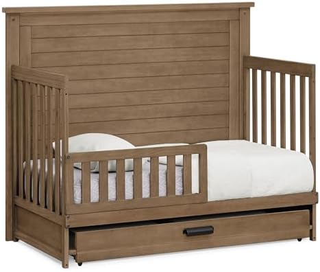Delta Children Simmons Kids Caden 6-in-1 Convertible Crib with Trundle Drawer, Greenguard Gold Certified, Aged Oak