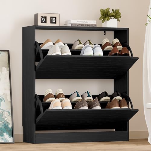 Black shoe rack with shoes on a wooden floor against a beige wall.