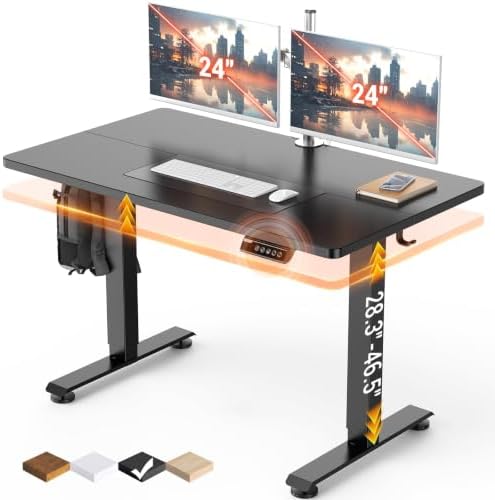 Black adjustable standing desk with dual monitor arms holding two 24-inch screens, shown on a white background with floating orange glow effects and height markings. Small color swatches appear at the bottom left.