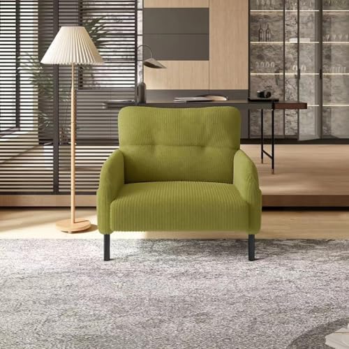 A modern armchair upholstered in textured olive green fabric with dark metal legs, set in a contemporary living room with a floor lamp, rug, and wooden slat wall.