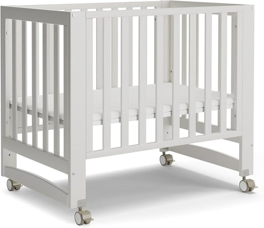 MAMAZING EvoNest 6-in-1 Convertible Baby Mini Crib with Wheels | GREENGUARD Gold Certified, New Zealand Pine Wood, 4 Adjustable Heights, Rocking Mode, Small Spaces Design, White