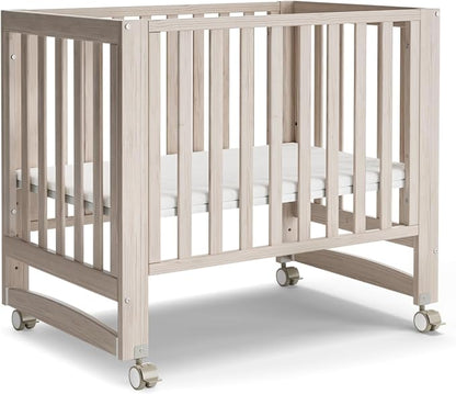 MAMAZING EvoNest 6-in-1 Convertible Baby Mini Crib with Wheels | GREENGUARD Gold Certified, New Zealand Pine Wood, 4 Adjustable Heights, Rocking Mode, Small Spaces Design, Washed Natural