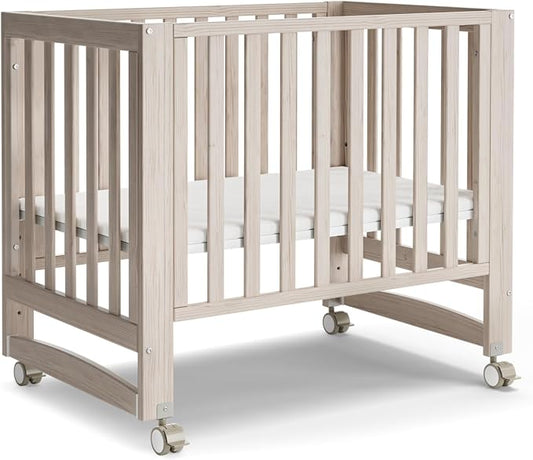 MAMAZING EvoNest 6-in-1 Convertible Baby Mini Crib with Wheels | GREENGUARD Gold Certified, New Zealand Pine Wood, 4 Adjustable Heights, Rocking Mode, Small Spaces Design, Washed Natural
