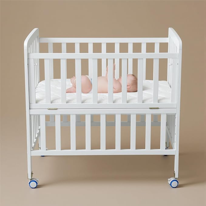 Flwrgirl Convertible Mini Baby Crib - Portable Bedside Bassinet with Mattress Included,3 Heights Baby Crib with Wheels for Small Room and Newborns 0-12 Months,White