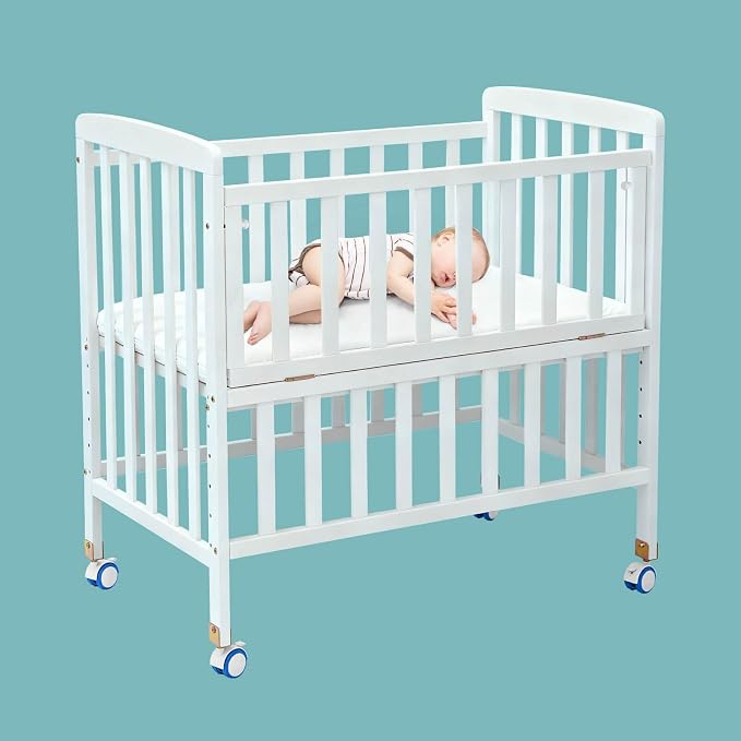 Flwrgirl Mini Baby Crib with Mattress,Portable Bedside Sleeper & Bassinet,6 Adjustable Heights,Wood Nursery Crib with Locking Wheels,Compact Baby Bed for Newborns & Infants,White