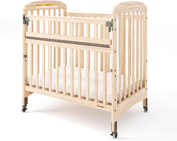 Foundations Serenity SafeReach Slatted Crib with Adjustable Mattress Board, Compact Wooden Baby Crib with Commercial Grade Casters, Includes 3” Foam Mattress (Natural)