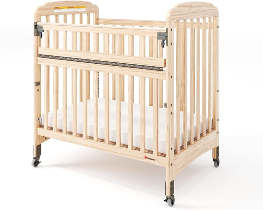 Foundations Serenity SafeReach Slatted Crib with Adjustable Mattress Board, Compact Wooden Baby Crib with Commercial Grade Casters, Includes 3” Foam Mattress (Natural)