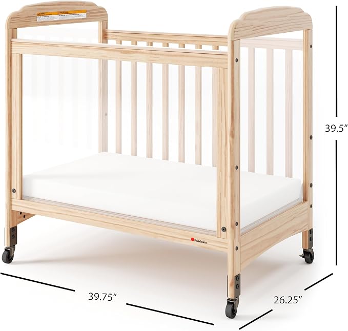 Foundations Serenity Compact 3 Side Clearview Daycare Crib Natural, Fixed Side, Durable Wood Construction, Non-Marking Casters (2 Locking), Includes 3” InfaPure Foam Mattress