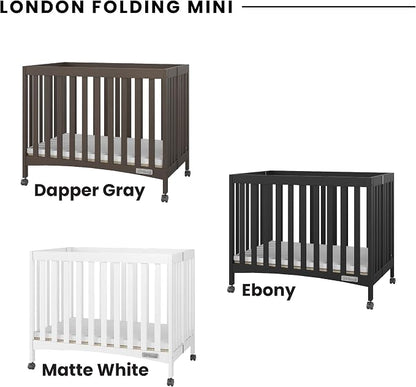 Child Craft London Mini Compact Folding Portable Crib with 2” Crib Mattress and 2 Easy Roll Locking Wheels, Durable Pine Wood Construction (Ebony Black)
