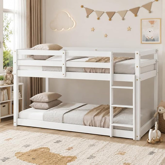 Twin Over Twin Bunk Bed, Low Profile Wooden Frame for Kids Bedroom, Floor Bunk with Ladder and Guardrails, Rubber Wood Construction, 13 Plywood Slats, No Box Spring Needed (White)