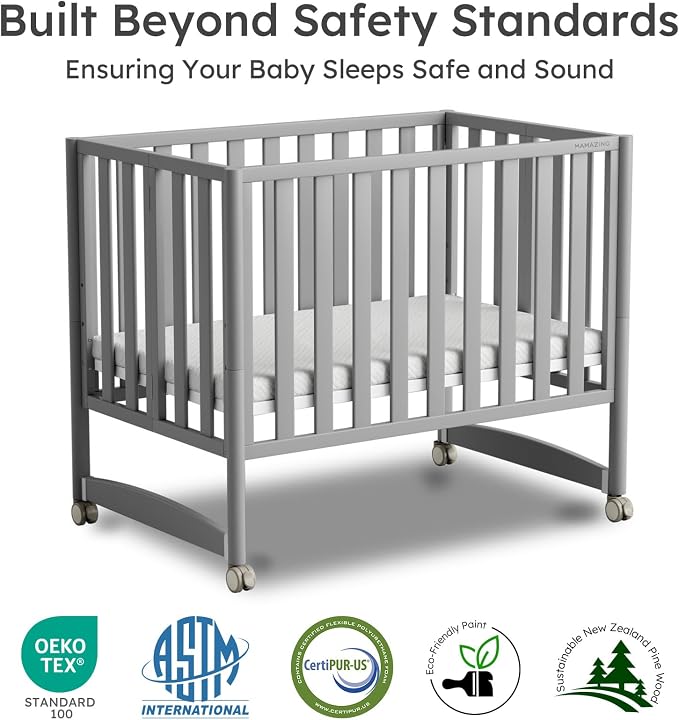 MAMAZING EvoNest 7-in-1 Convertible Baby Mini Crib with Wheels | GREENGUARD Gold Certified, New Zealand Pine Wood, 4 Adjustable Heights, Rocking Mode, Small Spaces Design, Grey