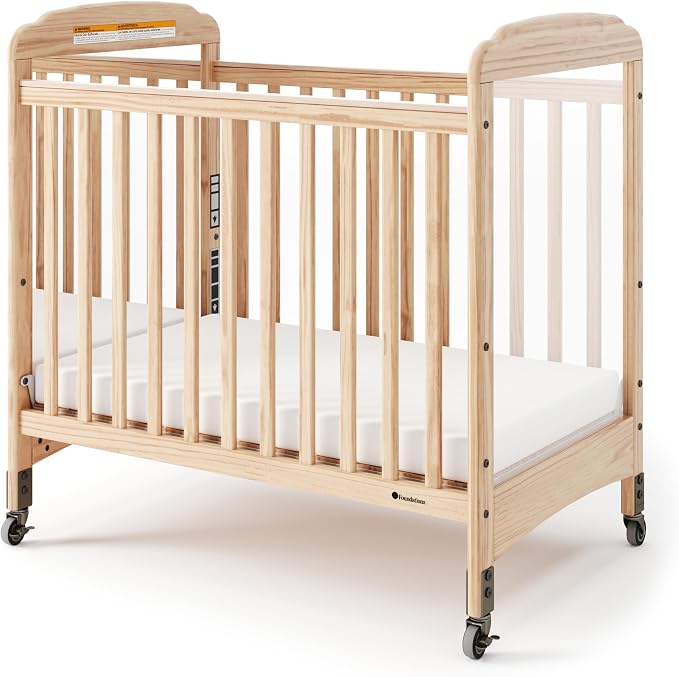 Foundations Serenity Compact Mirrorview Daycare Crib, Fixed Side, Features Mirrorview End Panels and Slatted Side Panels, Durable Wood Construction, Includes 3” InfaPure Foam Mattress (Natural)