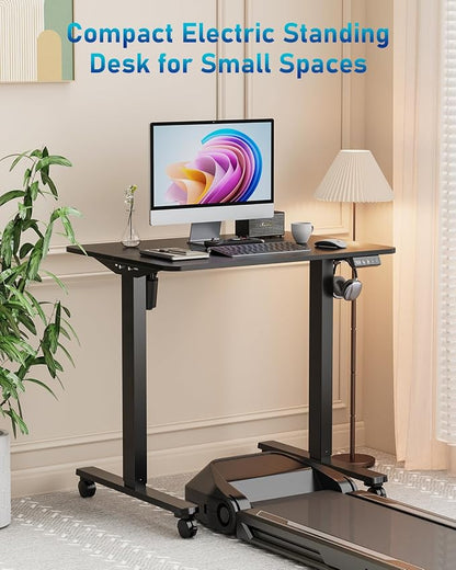 32" Small Electric Rolling Standing Desk Adjustable Height, Mobile Sit Stand up Desk with Lockable Casters for Home Office & Computer Workstation, Splice Board, 2 Hooks, Black Frame/Black Top