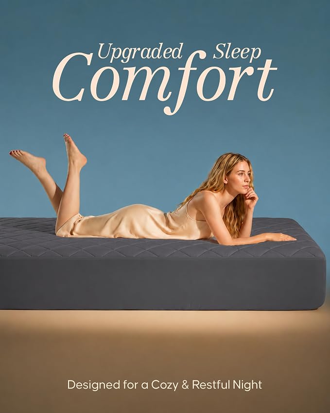 A woman in a beige slip dress reclines on a dark gray mattress against a blue background, with the text 'Upgraded Sleep Comfort' at the top and 'Designed for a Cozy & Restful Night' at the bottom.