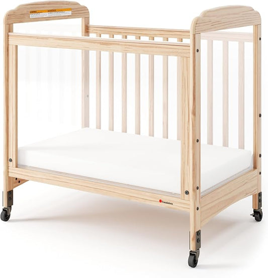 Foundations Serenity Compact 3 Side Clearview Daycare Crib Natural, Fixed Side, Durable Wood Construction, Non-Marking Casters (2 Locking), Includes 3” InfaPure Foam Mattress