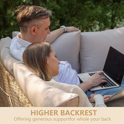 Two people sitting on a couch with a laptop, emphasizing the higher backrest.