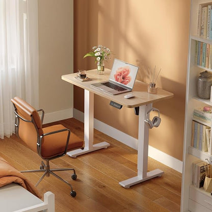 FEZIBO Small Standing Desk, 32 × 19 Inches Electric Height Adjustable, Sit and Stand Up, Computer Office Desk with Splice Board, White Frame/Maple Top