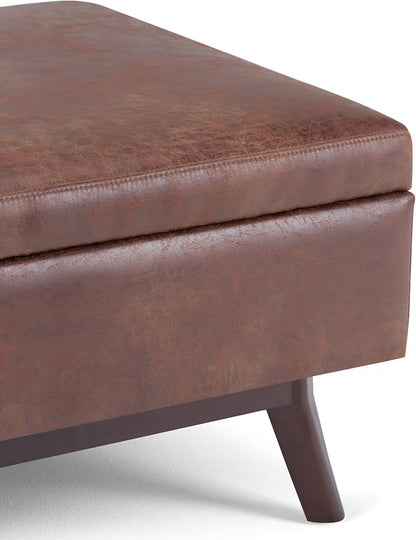 SIMPLIHOME Owen Coffee Table Storage Ottoman - 34" Wide x 19" High Upholstered Vegan Leather Rectangular Lift-Top Ottoman in Distressed Saddle Brown, Mid-Century Modern Bench with Tapered Legs