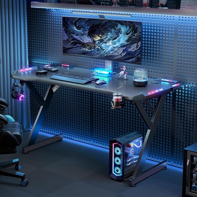 HLDIRECT 47 Inch Gaming Desk with LED Lights, Ergonomic Computer Gaming Table with Carbon Fibre Surface, Sturdy PC Workstation Desk for Home Office with Headphone Hook, Cup Holder, Black