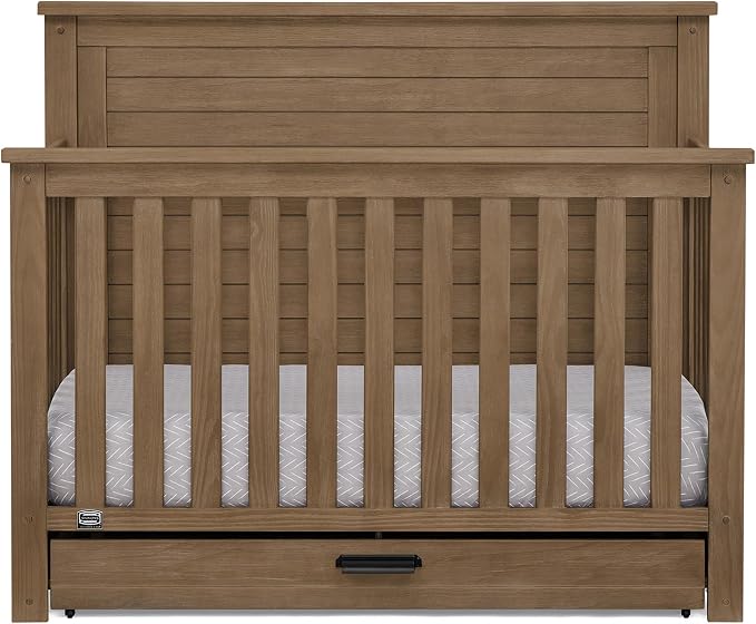 Delta Children Simmons Kids Caden 6-in-1 Convertible Crib with Trundle Drawer, Greenguard Gold Certified, Aged Oak