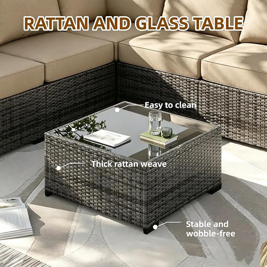 Rattan and glass table with text highlighting features, placed in front of a sectional sofa.