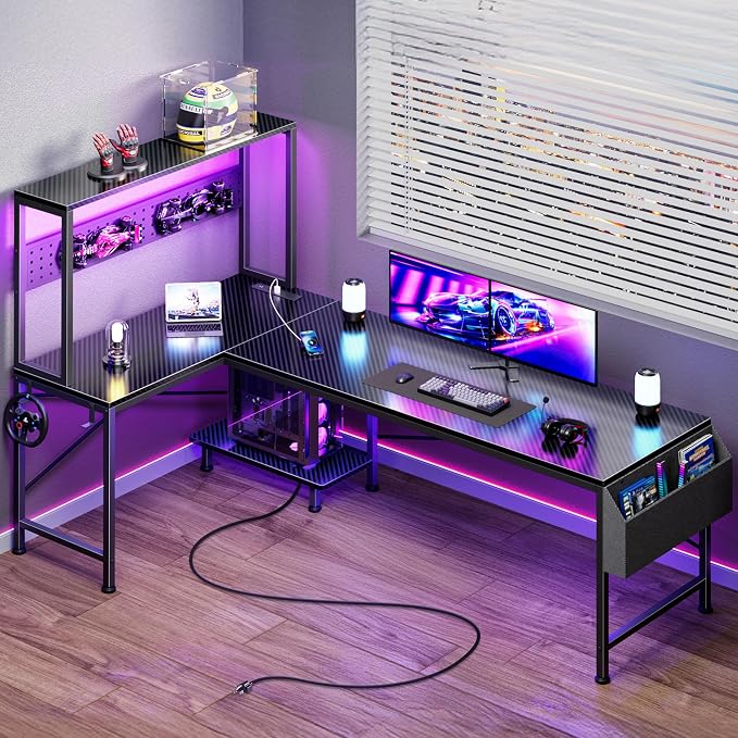 PRAISUN L Shaped Gaming Desk with LED Lights & Power Outlets, Reversible Computer Desk with Storage Shelves & Bag, Large Corner Home Office Desk with Pegboard for Work from Home, Carbon Fiber Black