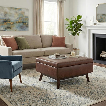 SIMPLIHOME Owen Coffee Table Storage Ottoman - 34" Wide x 19" High Upholstered Vegan Leather Rectangular Lift-Top Ottoman in Distressed Saddle Brown, Mid-Century Modern Bench with Tapered Legs