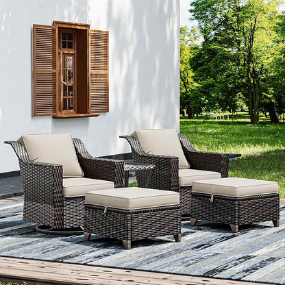 Outdoor patio furniture set with wicker chairs and ottomans on a deck.