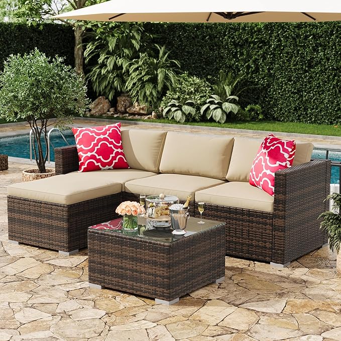 Outdoor patio set with sectional sofa, coffee table, and decorative pillows by a pool.