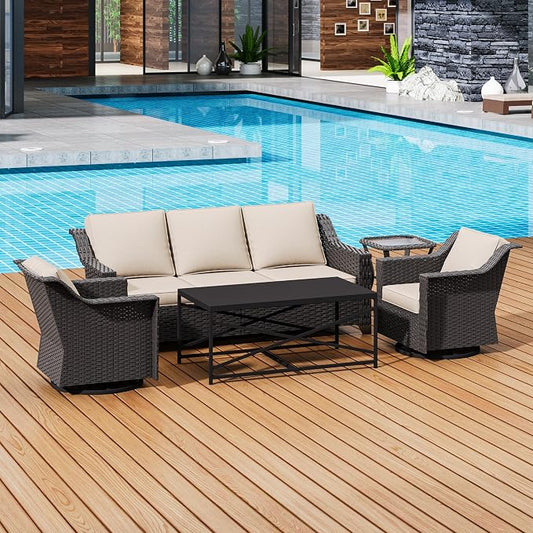 Outdoor patio furniture set with a sofa and chairs by a pool.